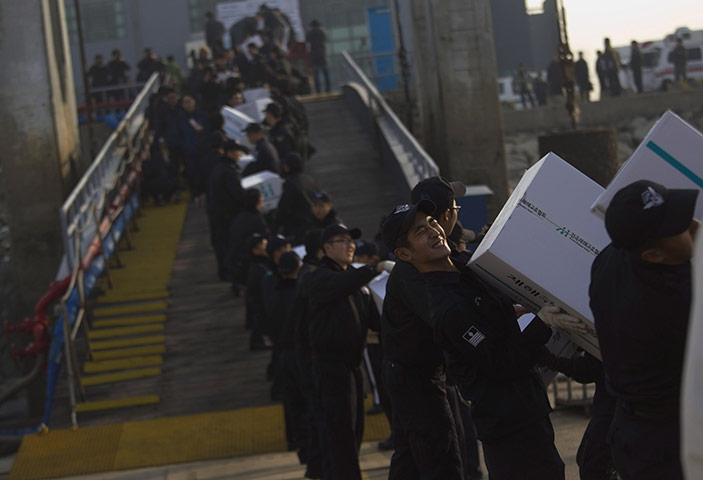 Yeonpyeong island : South Korean coast guard personnel load humanitarian aid supplies