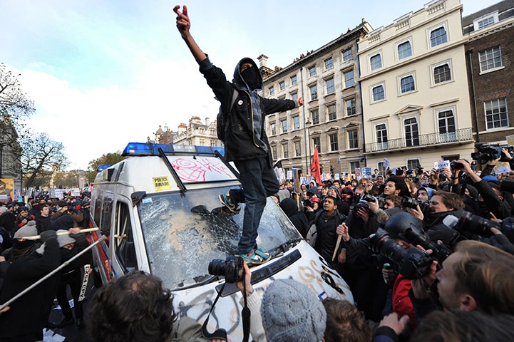 Student protests: Protesters target a police van during a demonstration in Westminster London