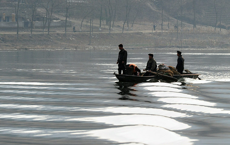 24 hours in pictures: North Korean fishermen along the border with China