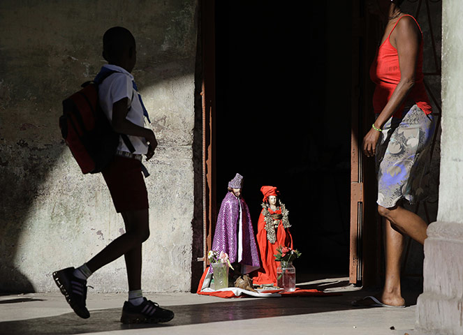 24 hours in pictures: Effigies of Cuban Saints Lazarus and Saint Barbara 