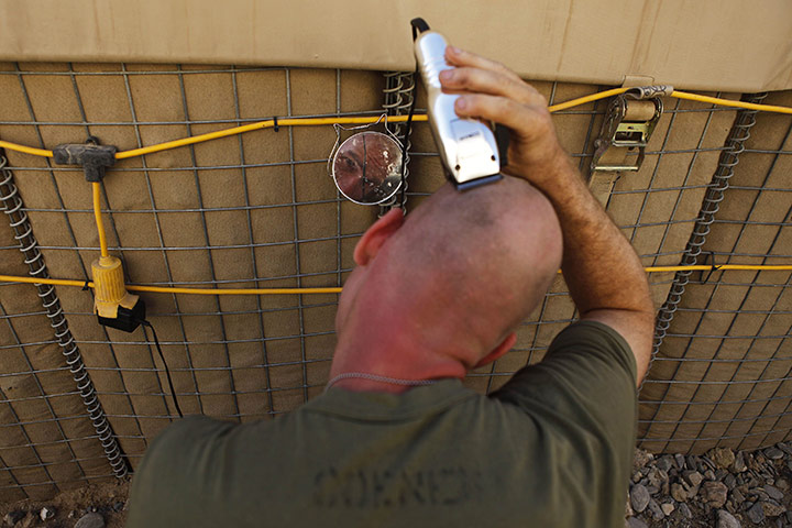 from the agencies: U.S. Marine shaves his head