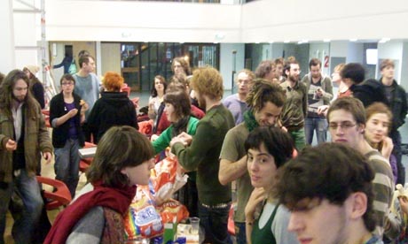 Edinburgh students tuck into food supplies last night during their occupation of Appleton Tower