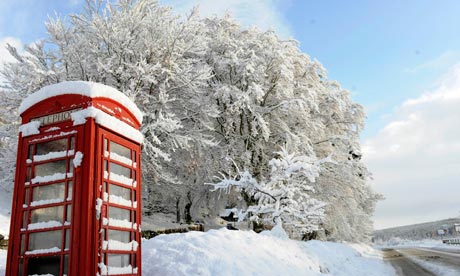 Snow covers a telephone box in Crathie in Scotland