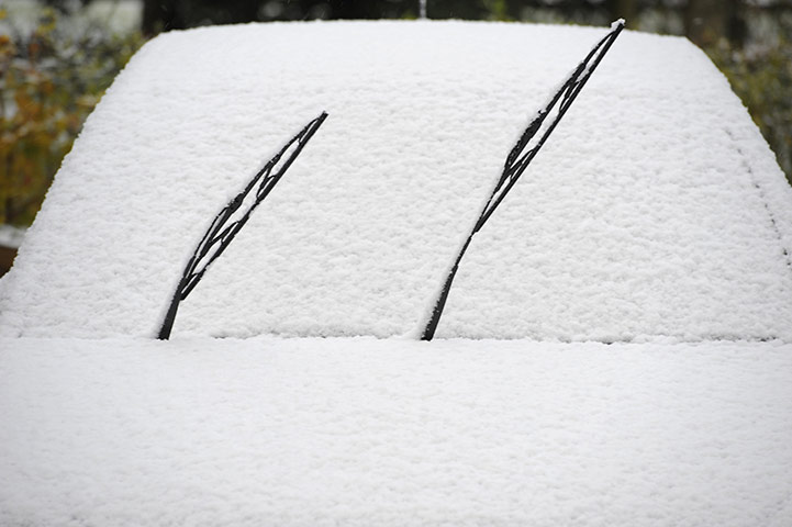Snow: winter Weather: A snow covered car is seen at Boroughbridge, northern England
