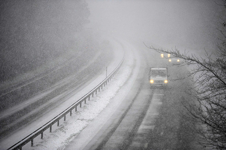 Snow: winter Weather: Vehicles travel along the snow covered A19 road at Topcliffe