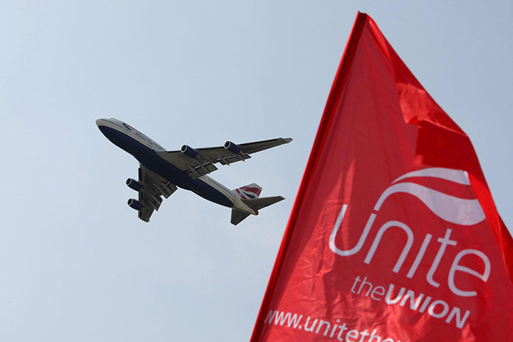 Business Week in Pictures: British Airways plane taking off over a Unite picket line near Heathrow