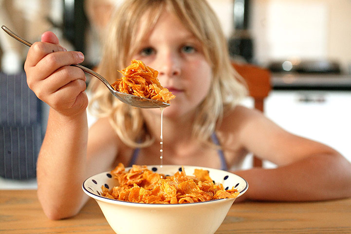 Business Week in Pictures: A child eating cornflakes - model Georgia Sillitoe