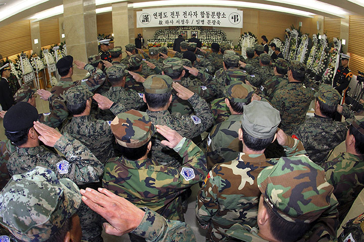 North Korea Update: South Korean veterans salute the altar during a memorial service