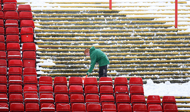 Weather Update: Snow is cleared from the terraces at Pittodrie Stadium Aberdeen