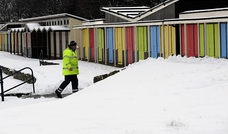 Weather Update: Snow covered beach huts in Filey, North Yorkshire