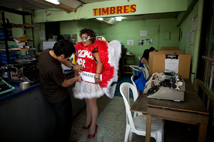 24 hours in pics: nternational Day for the Elimination of Violence against Women activist