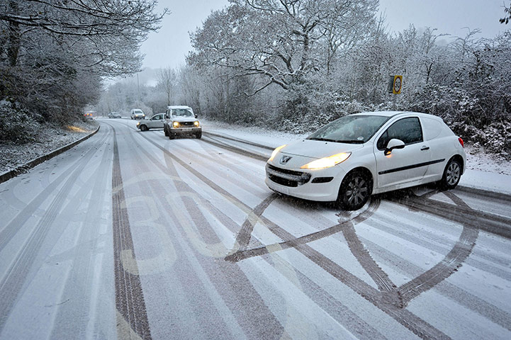 Winter Weather Update: Cars turn around as they struggle to climb the hill Tonyrefail