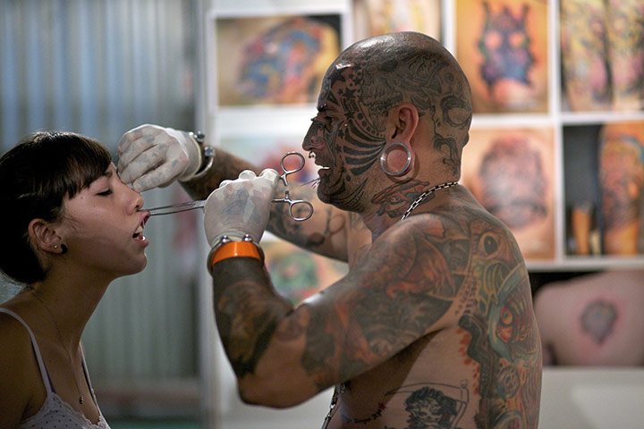 24 hours in pictures: Tattooist Victor Peralta