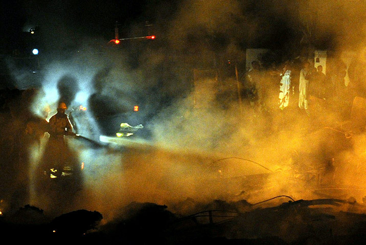 24 hours in pictures: cargo plane crash in karachi