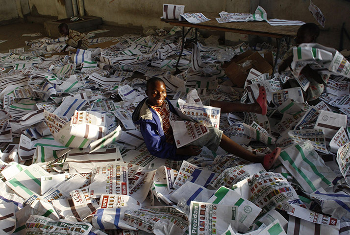 Haiti Elections: A Haitian child plays with ballots 