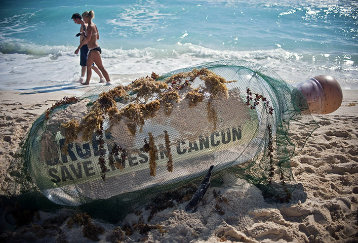 Year in Climate: COP16: a bottle with a message from Oxfam activists, Cancun