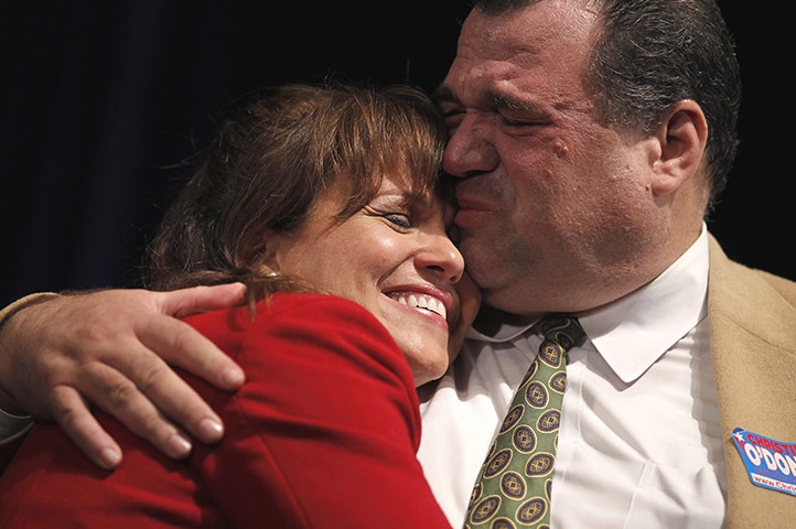 Midterm Election night : O'Donnell is kissed by her brother Dan at her election night rally in Dover