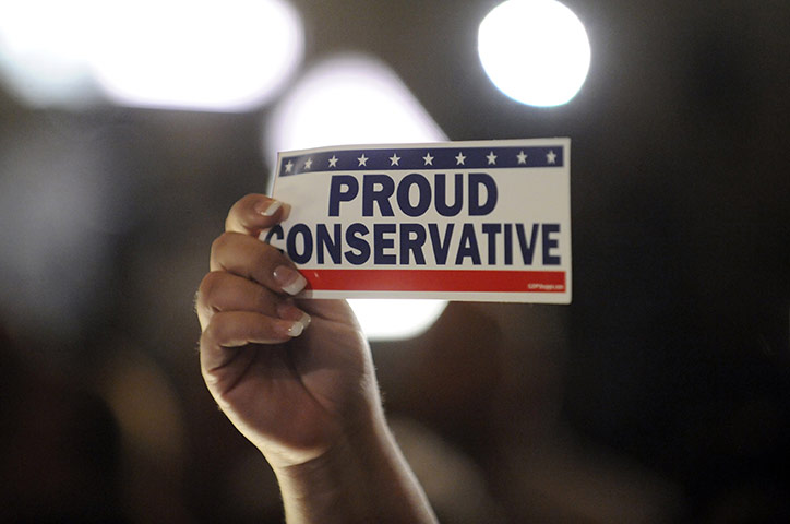 Midterm Election night : A supporter holds up a sticker at the California Republican Party 