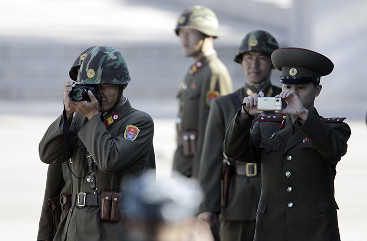 24hours in pics:  North Korean soldiers take pictures 