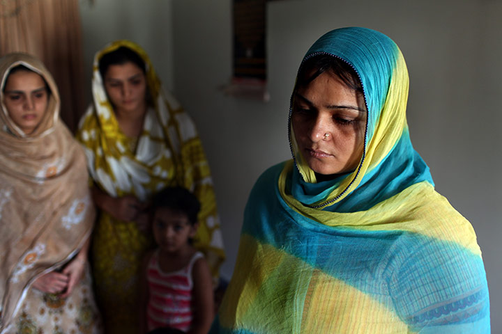 Karachi Pakistan: Sisters mourn the death of their father and two brothers