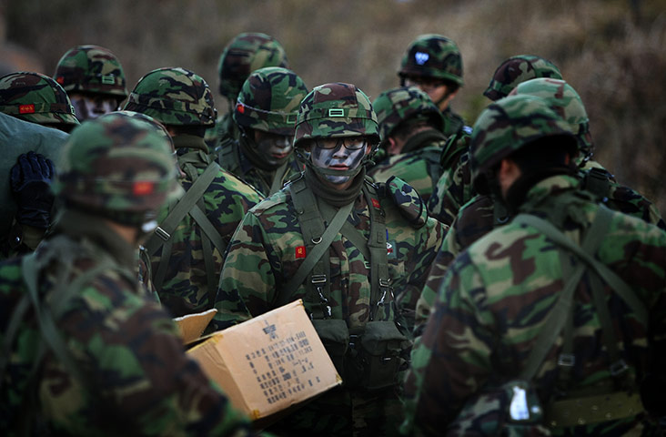 Korea tensions: 29 Nov: South Korean soldiers pack up camp during exercises 