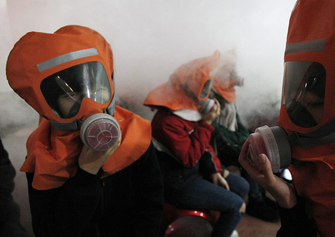 Korea tensions: 30 Nov: South Korean middle school students learn how to use gas masks