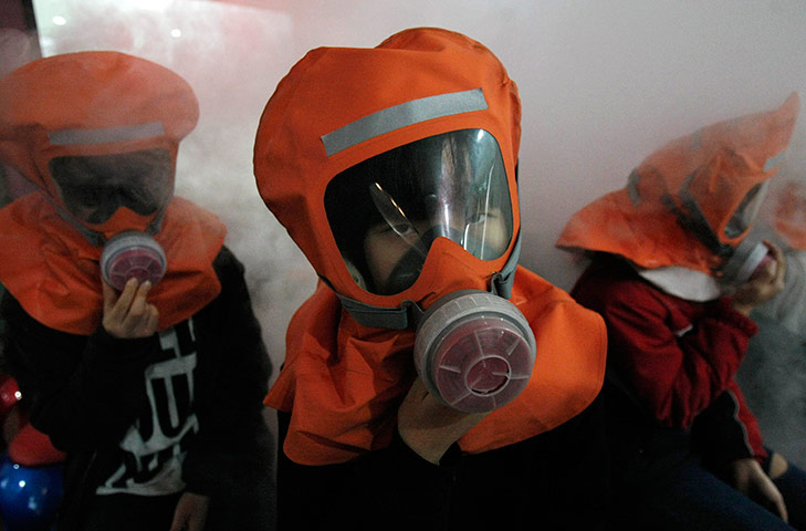 24 hours in pictures: South Korean students participate in an anti-chemical attack drill in Seoul