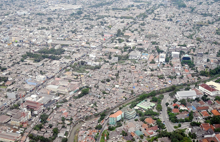 Mount Merapi Update: This aerial view shows houses in Yogyaka covered in ash