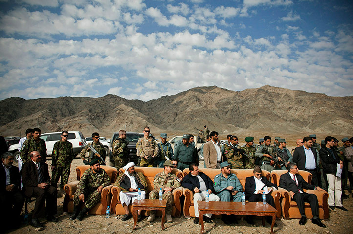 24 hours in pictures: Military, government and security officials attend a burning of opium