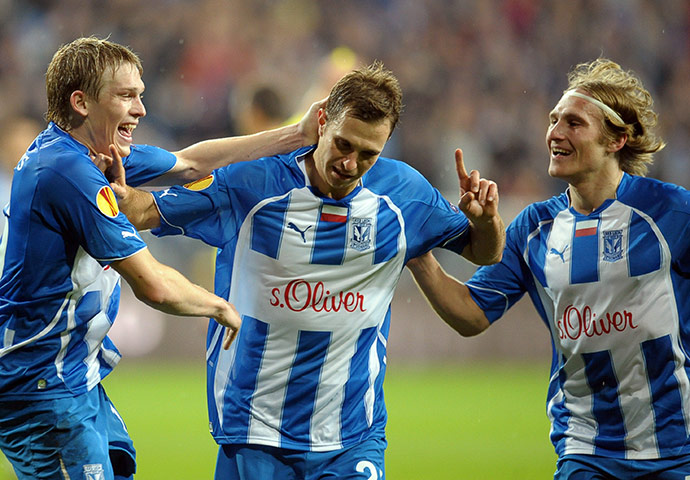 football: Dimitrije Injac (C) and Sergei Krivets