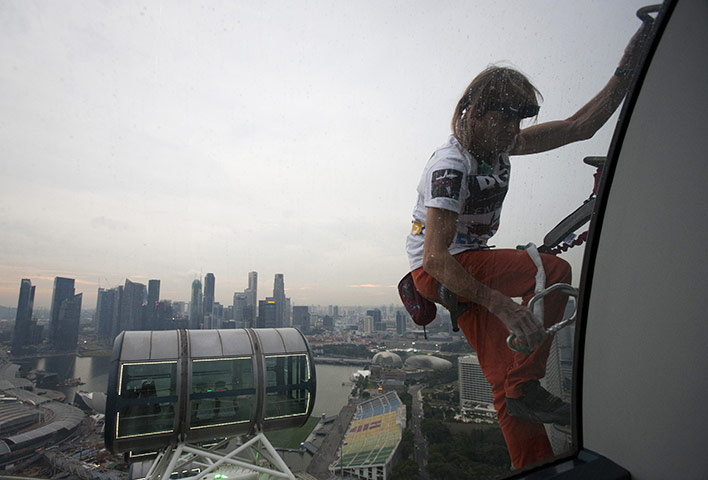 24 Hours: French climber Alain Robert scales the 165 metre high Singapore Flyer