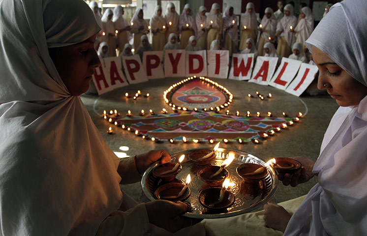 24 Hours: Indian Muslim students light earthen lamps to mark Diwali