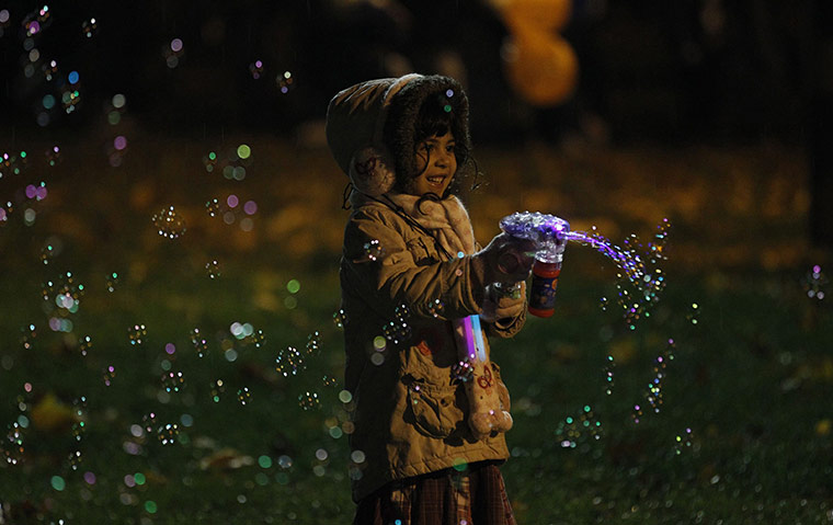 24 Hours: A girl sprays bubbles during Diwali celebrations in Leicester