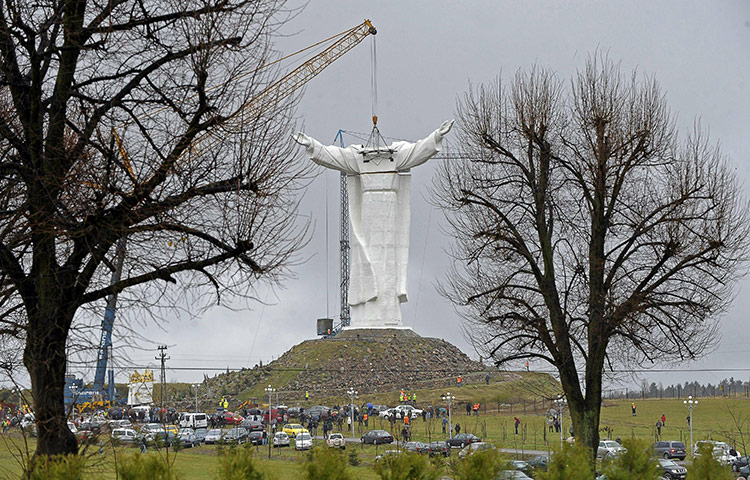 24 Hours: A crane lifts the arms of what will be the world's largest statue of Jesus