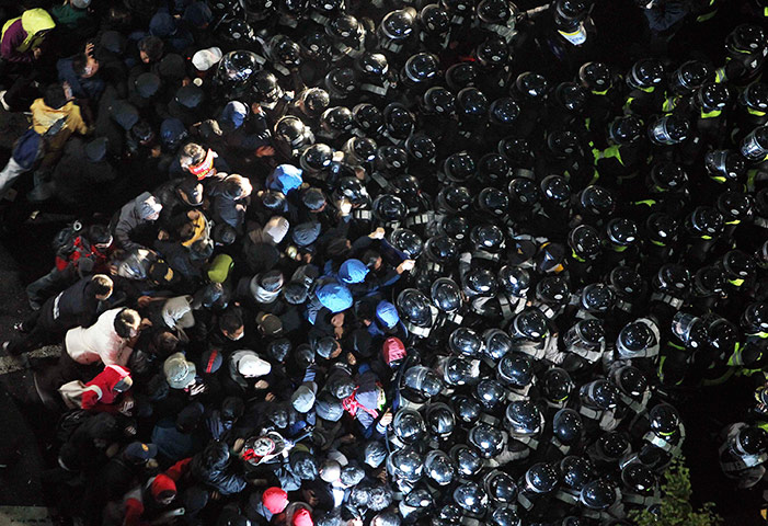 24 hours pics: Protesters struggle with riot police during a rally in Seoul