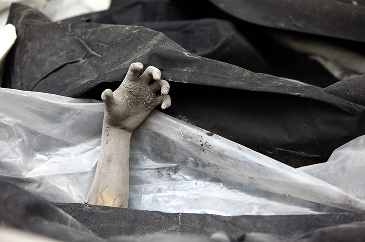 24 hours pics: A hand of a victim in Volcano Merapi's latest re-eruption