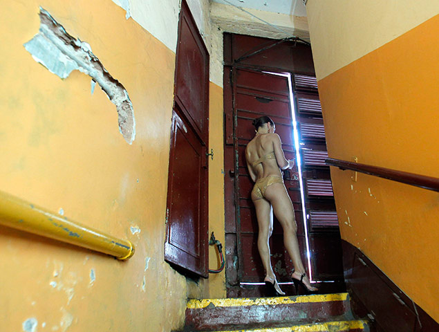 24 hours pics: A contestant waits for her turn to perform in Miss Pole Dancing