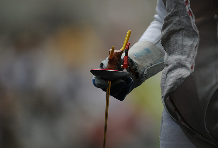 24 hours pics: A fencer holds a foil during a Fencing world championships
