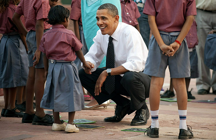 Obamas in India: Barack Obama shakes hands with child at Humayun's Tomb in New Dehli