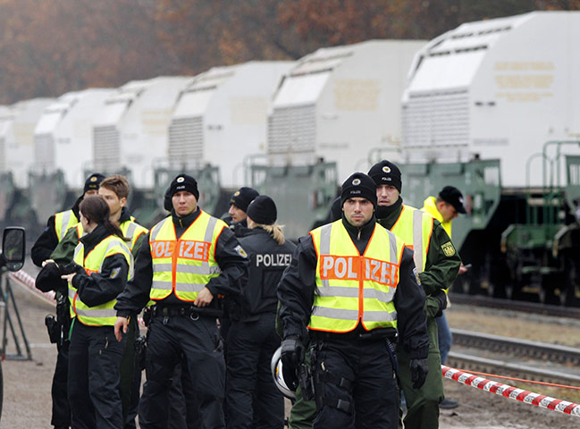 Anti-nuclear protests: Police officers stand in front of containers carrying nuclear waste