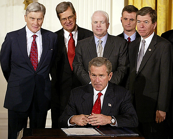 George W Bush: 16 October 2002: US President George W Bush signs congressional resolution 