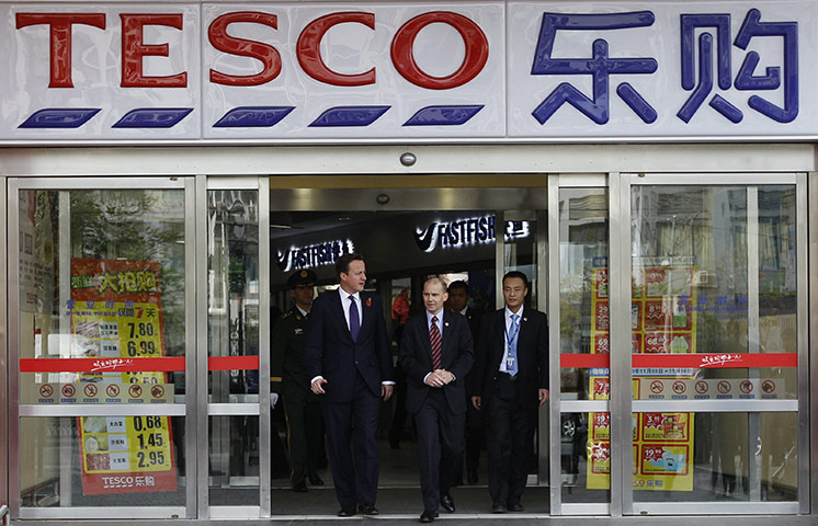 Cameron in China:  David Cameron leaves a Tesco store during a trade mission in Beijing