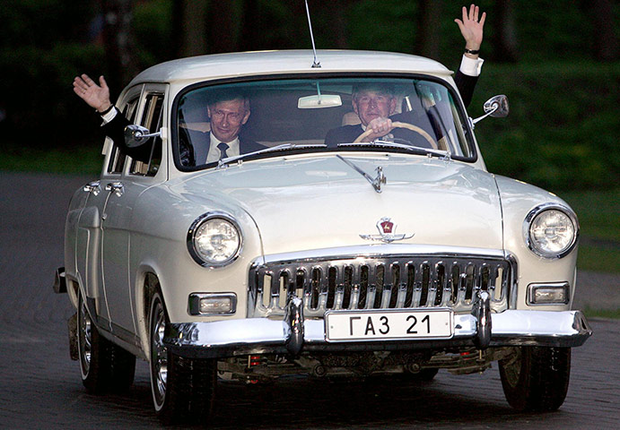 George W Bush: 8 May 2005: President Bush and Russian President Vladimir Putin wave 