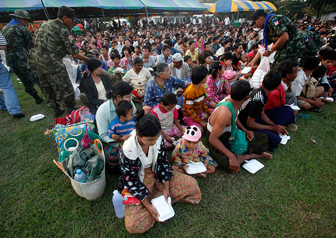 Burma refugees: Burma refugees receive food from officials