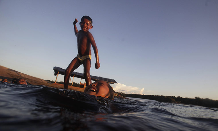 24 hours in pictures: Children from Bare tribe play in the Rio Negro 
