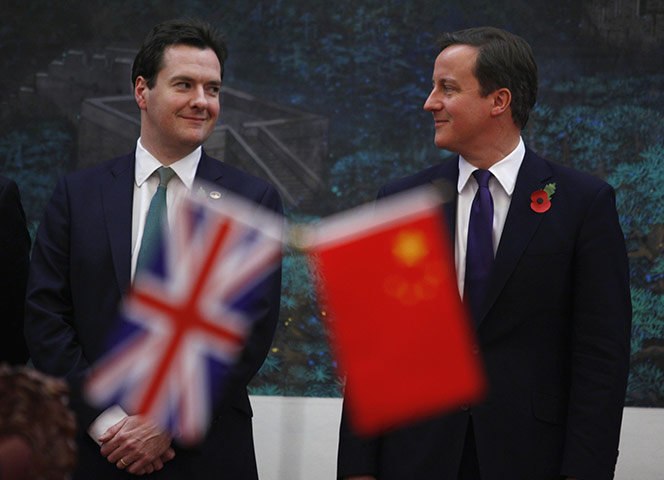 Cameron in china 2: David Cameron and George Osborne attend a signing ceremony 