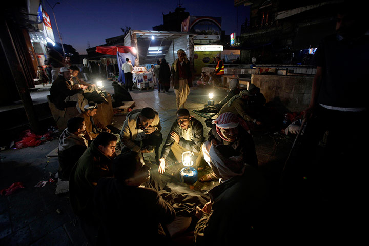 24 hours in pictures: Yemeni customers gather around vendors selling Qat