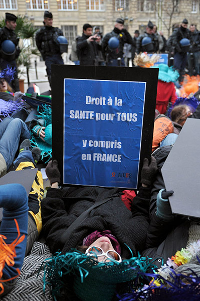 AIDS World day: Policemen stand guard in front of AIDS activist