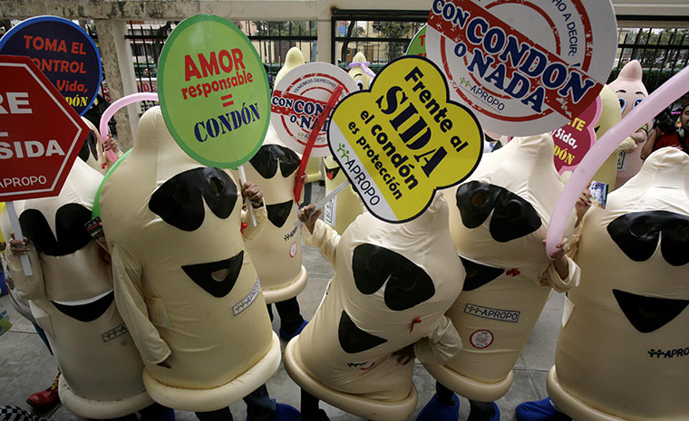 AIDS World day: People dressed as condoms hold up signs downtown Lima
