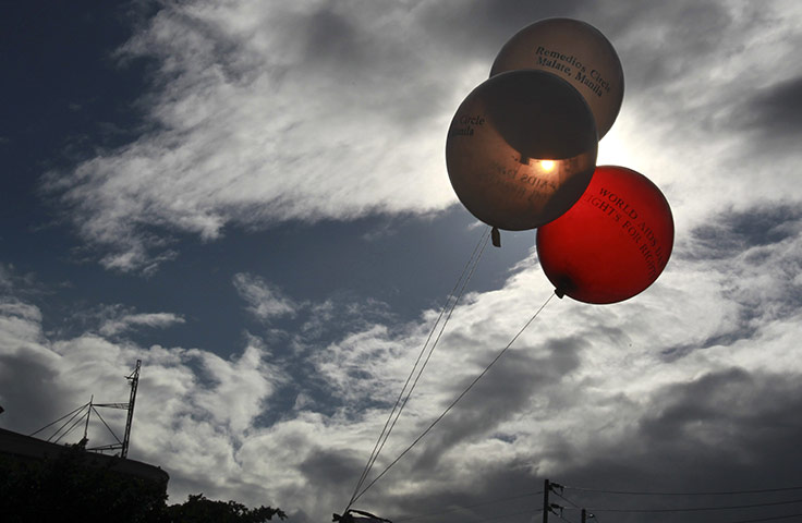 AIDS World day: Red and white balloons are tied to a platform during World AIDS Day